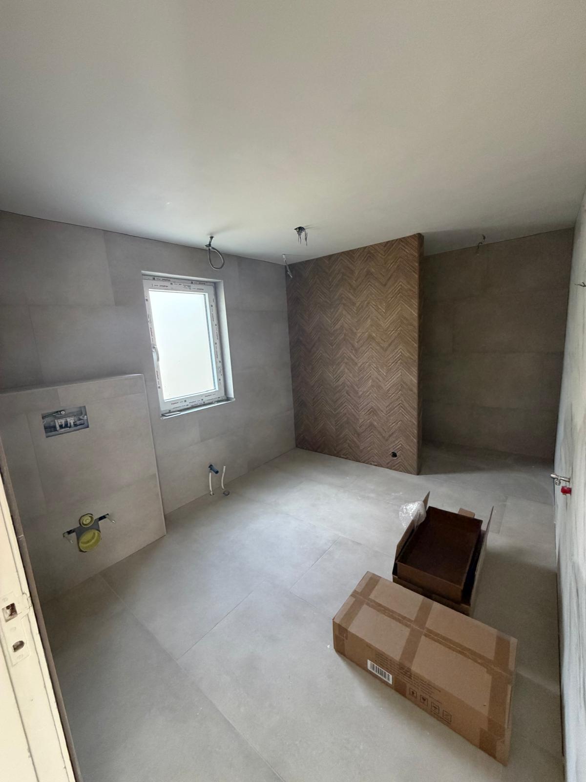 Badkamer betonlook met houtaccent — Haarlem